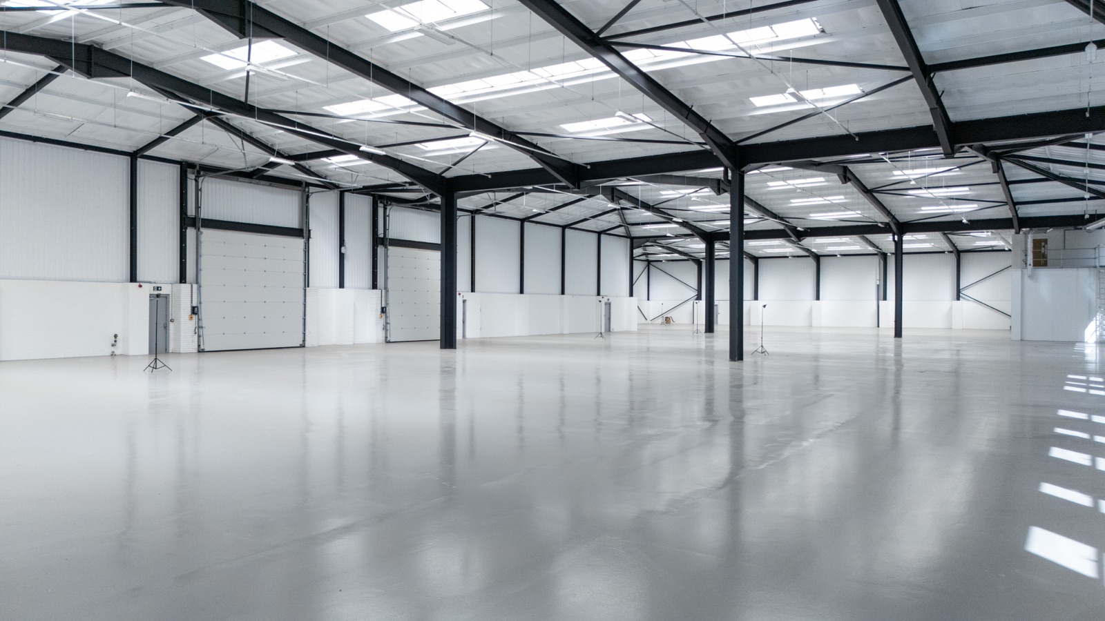 Open warehouse floor with roof lights and loading doors